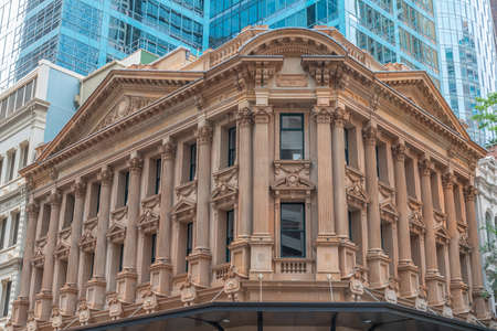 Contrast of a historical house in front of a skyscraper in the center of Sydney, Australiaの写真素材
