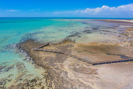 Wooden boardwalk at Hamelin pool used for view at stromatolites, Australiaの写真素材