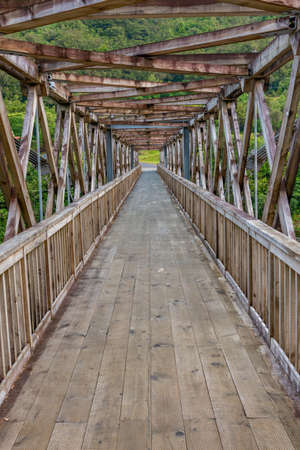Bridge leading to Brunner Mine Historic Area in New zealandの写真素材