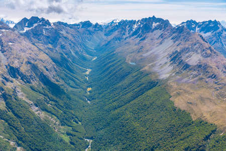 Aerial view of a river winding through Southern Alps near Queenstown in New Zealand