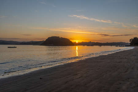 Sunset view of a beach at Paihia, New Zealandの写真素材