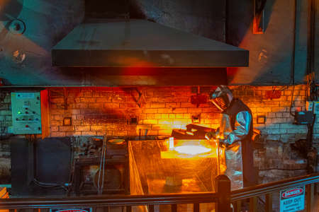 PERTH, AUSTRALIA, JANUARY 18, 2020: show displaying a process of manufacturing a golden bar at Perth...