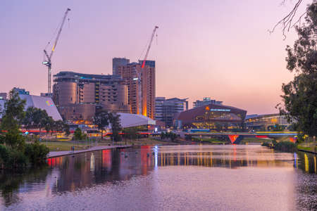 ADELAIDE, AUSTRALIA, JANUARY 7, 2020: Sunset view of Adelaide Convention center on Riverside of Torrens in Australiaのeditorial素材