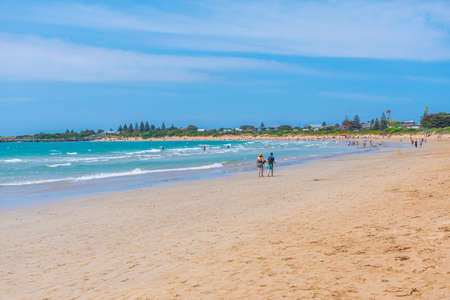 APOLLO BAY, AUSTRALIA, JANUARY 3, 2020: People are enjoying a sunny day on a beach at Apollo Bay, Australiaのeditorial素材