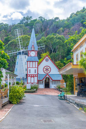 NELSON, NEW ZEALAND, FEBRUARY 5, 2020: Historial church and windmill at Founders Heritage Park at Nelson, New Zealandのeditorial素材