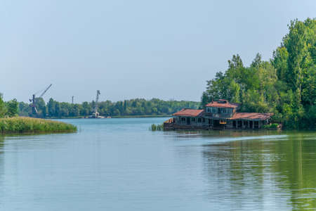 Broken house sunken into Pripyat river in the Ukraineの写真素材