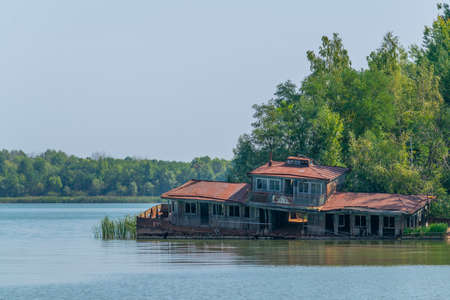 Broken house sunken into Pripyat river in the Ukraineのeditorial素材