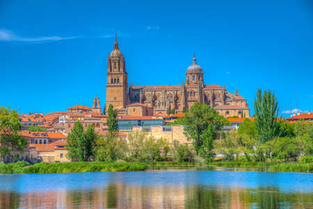 Cathedral at Salamanca reflected on river Tormes, Spainの写真素材