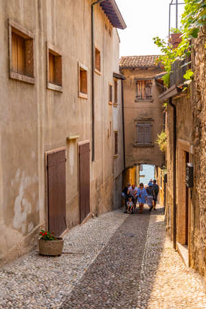 narrow street in Malcesine in Italyの写真素材