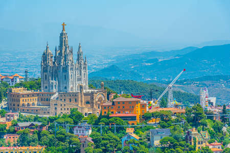 Temple of the Sacred Heart of Jesus and Tibidabo amusement park in Barcelona viewed from Torre de Collserola, Spainの写真素材