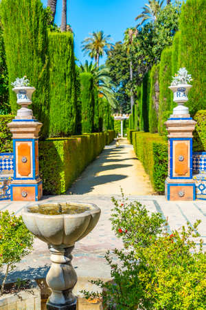 Fountain at gardens of Real Alcazar de Sevilla in Spainの写真素材
