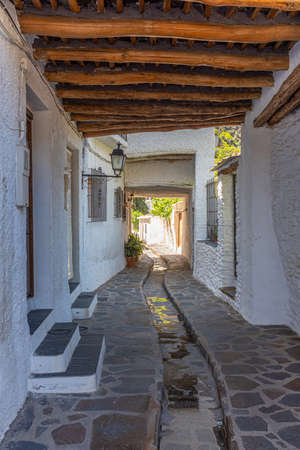 Typical white street of Pampaneira village in Spainの写真素材