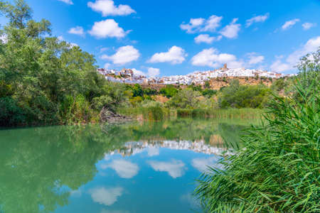 Arcos de la Frontera reflected on river Guadalete in Spainの写真素材
