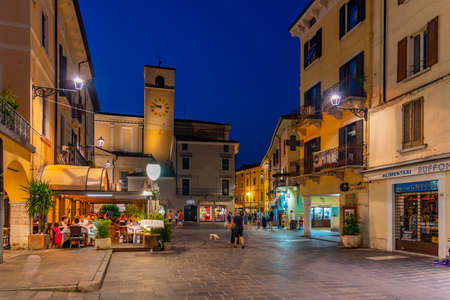 DESENZANO DEL GARDA, ITALY, JULY 23, 2019: Sunset view of Piazza Giuseppe Malvezzi in Desenzano del Garda in Italyのeditorial素材