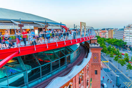 BARCELONA, SPAIN, JUNE 27, 2019: People watching sunset from Arenas de Barcelona shopping center in Spainの写真素材