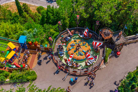 BARCELONA, SPAIN, JUNE 29, 2019: People are taking a ride on a carousel at Tibidabo amusement park in Barcelona, Spainのeditorial素材