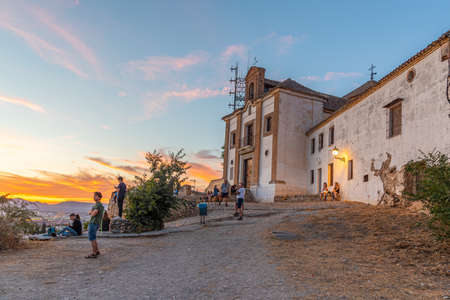 GRANADA, SPAIN, JUNE 21, 2019: People are enjoying sunset over Granada from Hermitage San Miguel Alto, Spainのeditorial素材