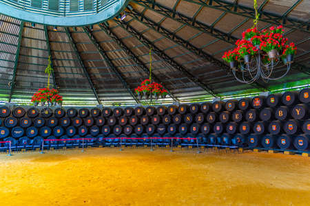 JEREZ DE LA FRONTERA, SPAIN, JUNE 26, 2019: Wine barrels inside of Bodega of Tio Pepe at Jerez de la...