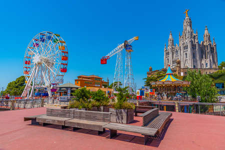 BARCELONA, SPAIN, JUNE 29, 2019: View of the Temple of the Sacred Heart of Jesus and Tibidabo amusement park in Barcelona, Spainのeditorial素材