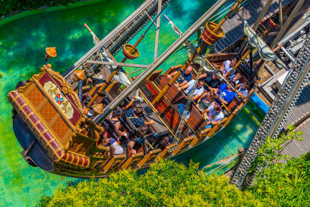 BARCELONA, SPAIN, JUNE 29, 2019: People are taking a ride on a swinging ship at Tibidabo amusement park in Barcelona, Spainのeditorial素材