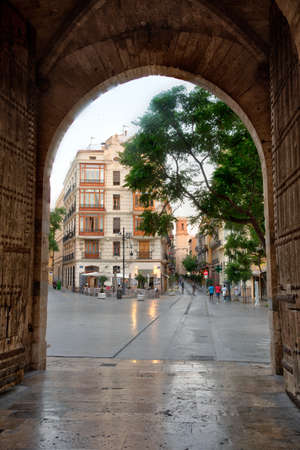 Carrer dels Serrans viewed through gate of torres de Serranos in Valencia, Spainのeditorial素材