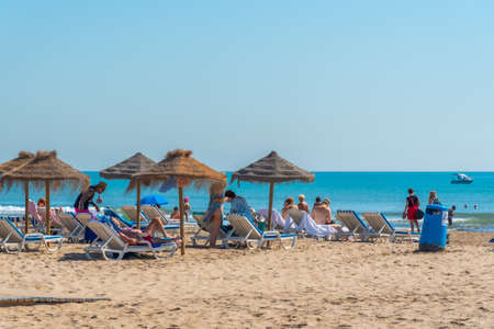 VALENCIA, SPAIN, JUNE 17, 2019: People are enjoying sunny day on Cabanyal beach in Valencia, Spainのeditorial素材