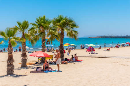 ALICANTE, SPAIN, JUNE 18, 2019: People are enjoying a sunny day on Postiguet beach in Alicante in Spainのeditorial素材