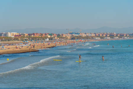VALENCIA, SPAIN, JUNE 17, 2019: People are enjoying sunny day on Cabanyal beach in Valencia, Spainのeditorial素材