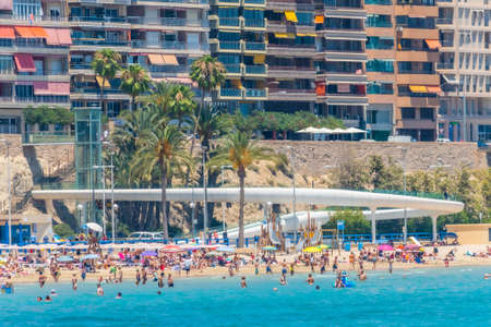 ALICANTE, SPAIN, JUNE 18, 2019: People are enjoying a sunny day on Postiguet beach in Alicante in Spainのeditorial素材