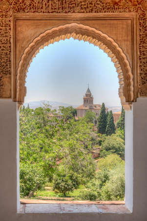 Alhambra viewed through window at Generalife arcade in Granada, Spainのeditorial素材