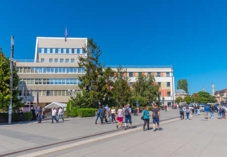 PRISHTINA, KOSOVO, SEPTEMBER 16, 2019: People are passing Government building in Prishtina, Kosovoのeditorial素材