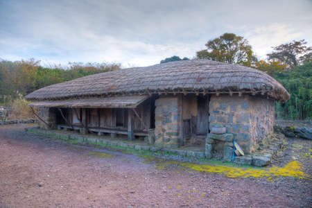 Traditional buildings at Jeju Stone park in Republic of Koreaのeditorial素材