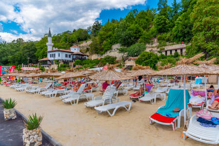 BALCHIK, BULGARIA, JULY 13, 2019: People are enjoying a sunny day on a beach in Balchik, Bulgariaのeditorial素材