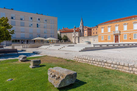Church of Saint Ilija behind Roman ruins at Zeleni trg square in Zadar, Croatiaの写真素材