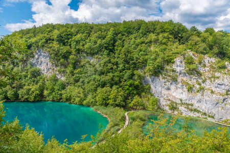 Aerial view of a wooden boardwalk leading through plitvice lakes national park in Croatiaの写真素材