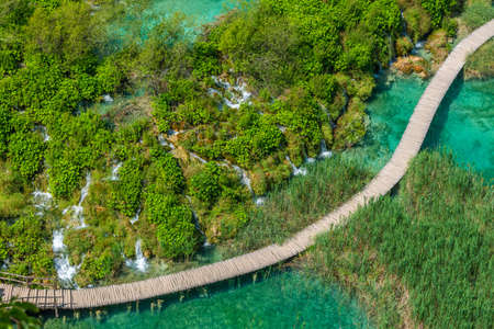 Aerial view of a wooden boardwalk leading through plitvice lakes national park in Croatiaの写真素材