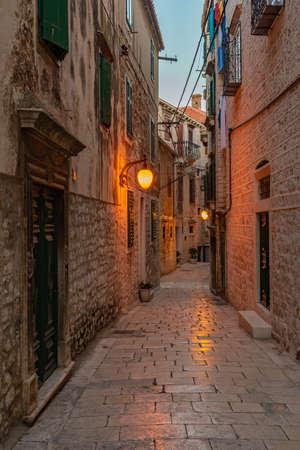 Old narrow street in the old town of Sibenik, Croatiaの写真素材