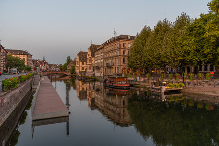 Sunrise view of the waterfront of a channel passing through the old town of Strasbourg, Franceの写真素材
