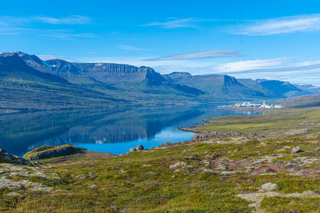 Natural landscape of Reydarfjordur and alluminium production facility on Icelandの写真素材