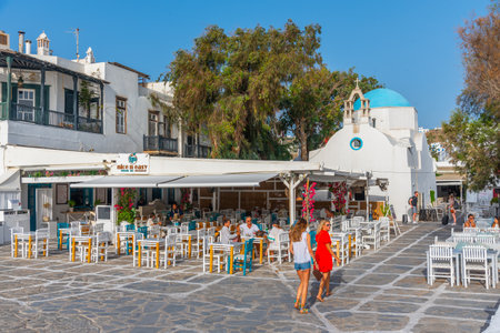 Mykonos, Greece, September 26, 2020: People eating at a restaurant at the old town of Mykonos, Greeceのeditorial素材