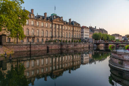 Sunrise view of Palais Rohan reflecting on water in Strasbourg, Franceのeditorial素材