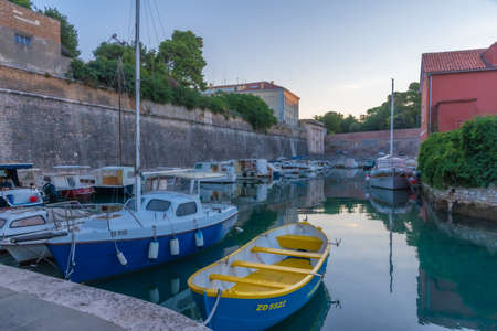 Sunrise view of a marina situated next to the land gate in Croatian town Zadarのeditorial素材
