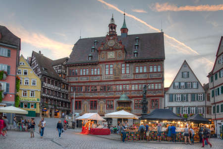 Tubingen, Germany, September 19, 2020: Sunset view of decorated town hall at the Marktplatz at the...