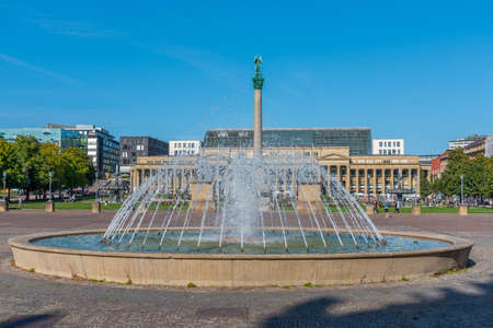 People are enjoying a sunny day at Schlossplatz in Stuttgart, Germanyのeditorial素材