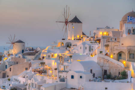 Sunset over Oia village In Santorini island, Greeceのeditorial素材
