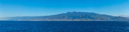 Seaside view of Tenerife dominated by Pico de Teide volcano, Canary islands, Spain.の写真素材