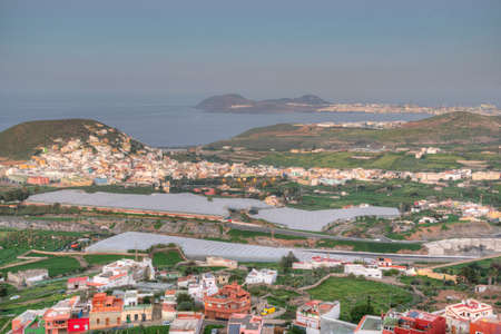 Sunset view of coastline of Gran Canaria stretching towards Las Palmas, Canary Islands, Spain.の写真素材