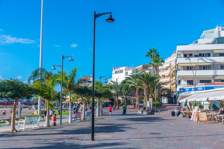Los Cristianos, Spain, January 13, 2021: People are walking at promenade at Los Cristianos, Tenerife, Canary Islands, Spain.のeditorial素材