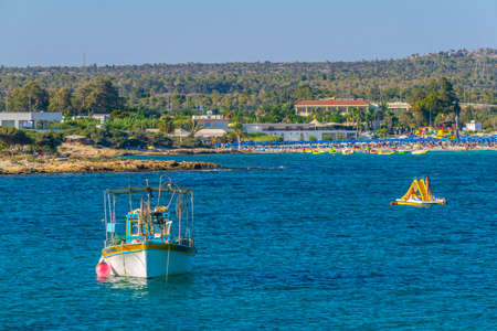 People are enjoying a sunny day at a beach at Agia Napa, Cyprusのeditorial素材