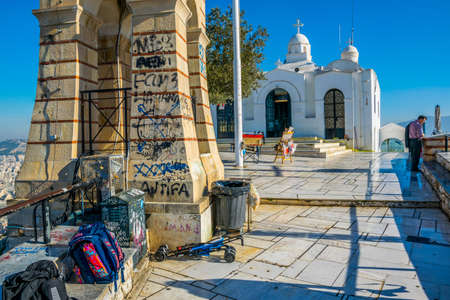 ATHENS, GREECE, DECEMBER 10, 2015: a group of tourists is admiring view of athens from the top of lycabetus hillのeditorial素材